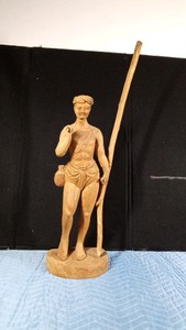 Hand- carved wooden sculpture of an Indian fisherman or traveler, likely made in India