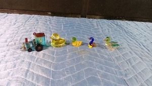 4 pieces of hand blown miniature train and ducks and 1 crystal duck