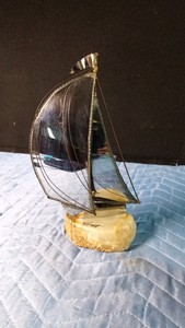 Signed vintage DeMott brassmetal sail boat mounted on a natural quartz base by Artist John DeMott