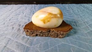 Camelian agate egg on a Brazilian Banded agate base