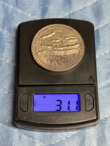 1 Troy Ounce .999 Fine Silver Trade Unit round. This is a private-mint bullion roundhistorically produced by mints like Northwest Territorial Mint (NWTM) or American Pacific Mintfeaturing the classic balance scales design on the obverse.