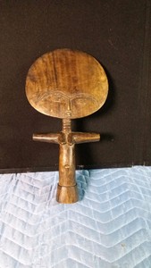 Akuabe firtility doll. Hand-carved wooden Ghanaian folk art. These dolls were used by women to conceive a child. The flat head represents the ideal of physical and spiritual beauty, the neck symbolizes physical health, beauty, and prosperity, and the T s