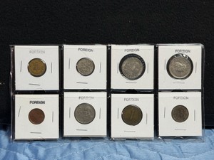 Lot of 8 Collectible Foreign Coins in Protective Sleeves
