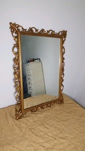Large gold tone framed mirror