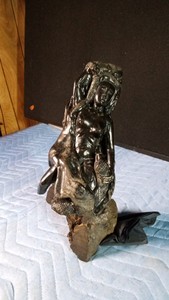 Hand-carved African tribal sculpture typicallcarved from dense, dark ebony wood