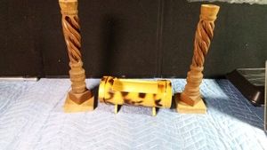 Vintage hand-carved olive wood candlesticks typically sourced from Bethlehem mounted on a block of wood and a bamboo looking planter