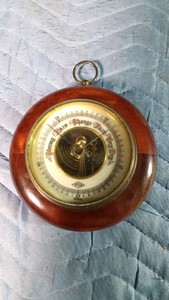 Vintage ATCO aneroid barometer produced in Germany (a brass face with a circular wooden case)
