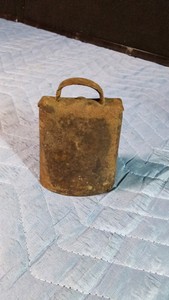 19th century Classic sheet-iron primitive cow bell ( shaped by folding a single piece of sheet metal securing the seams on the sides with hand-driven iron rivets
