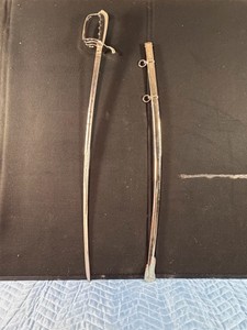 United States Model 1902 Army Officers Saber with its matching metal scabbard. Officially adopted in July 1902, this distinct pattern serves as the regulation ceremonial dress sword for officers in the United States Army and United States Air Force