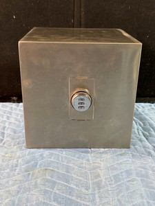 Stainless steel password piggy bank designed for saving cash and coins.