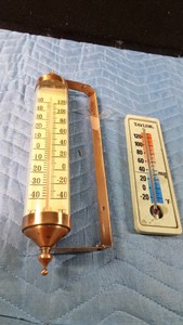 2 Weather thermometers (1 copper and one advertisement)