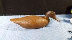 Vintage hand carved wooden duck decoy with brass eyes