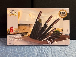6-piece Five Cows kitchen knife set featuring honeycomb-patterned blades and wooden handles