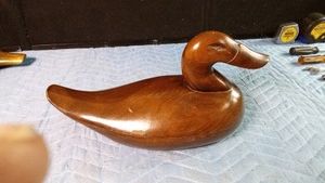 Wooden carved wood decoy with carved out eyes