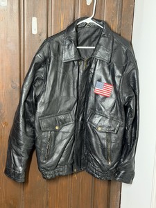 Leather Jacket with the American Flag Patch on the Front and God Bless America Patch on the Back