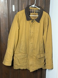 Outdoor Life brand tan barn jacket featuring a brown corduroy collar and plaid flannel lining