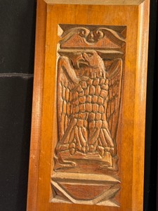 Hand-carved wood panel featuring a majestic eagle motif