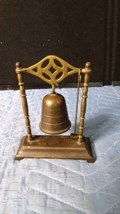 Vintage Asian style brass suspended bell on stand with matching striker or mallet for ringing