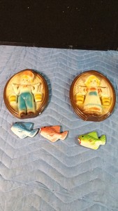 Dutch girl and boy plaques and 3 small fish plaques