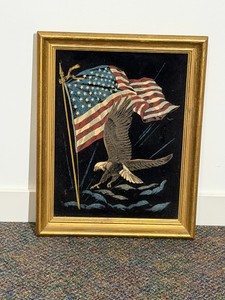 Vintage black velvet painting featuring an American bald eagle and a United States flag.