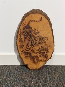 Vintage wood-burned (pyrography) wall plaque depicting a roaring tiger
