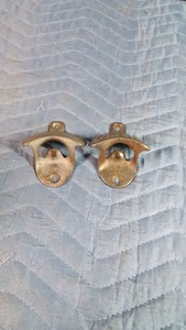 2 Vintage cast iron Starx wall-mounted bottle openers branded for Coca-Cola