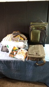 2 suitcases, blanket ,cloth bags and table cloths and more