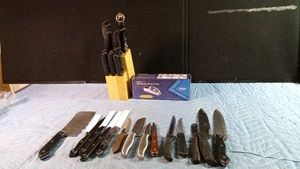 knife block of knives plus many other kitchen knives and an electric knife grinder