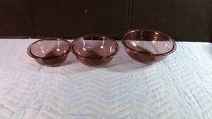 3 Purple glass bowls