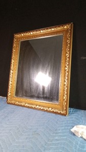 Gold tone framed mirror
