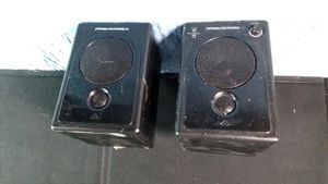 Cerwin-Vega powered desktop speakers featuring a 3 woofer and a 34 tweeter within a wood enclosure with front panel controls fo volume, headphone jack and auxiliary input.