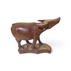 Vintage hand-carved wooden water buffalo sculpture, frequently identified in folk art and Asian-inspired home decor