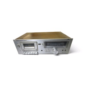 Vintage MCS (Modular Component Systems) 3540 stereo cassette deck with a silver faceplate and wood-grain side panels