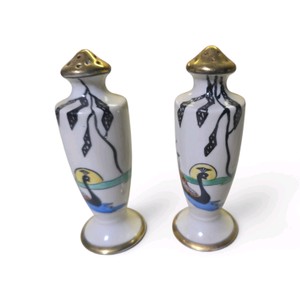 Vintage Japanese porcelain salt and pepper shakers featuring a hand-painted river swan or gondola scene with gold trim.