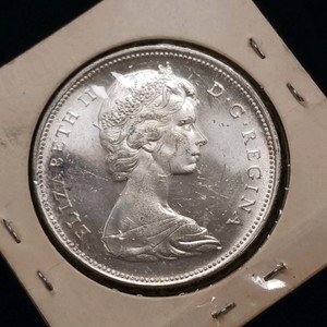 1966 Canadian Voyageur silver dollar featuring Queen Elizabeth II