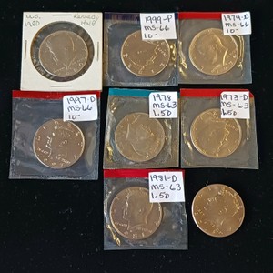 Lot of (8) Kennedy Half Dollars - Uncirculated Mint State (MS) - Includes 1973-D, 1978, 1980, 1981-D, 1997-D, 1999-P