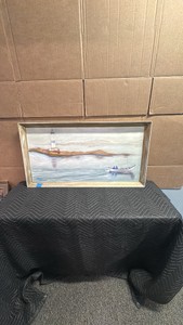 This is a vintage framed nautical painting depicts a lighthouse on the coast