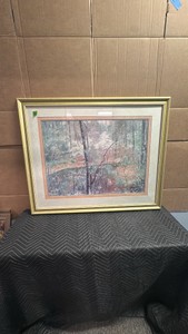 This framed and matted print,  titled Spring, is a 1987 work by artist Thompson featuring a misty, pastel-toned forest scene.