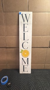 Vintage Welcome sign on white plank board and welcome summer