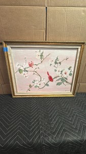 Framed floral and bird artwork appears to be a vintage decorative painting featuring red cardinals perched among white blossoms on a soft pink and neutral gradient background