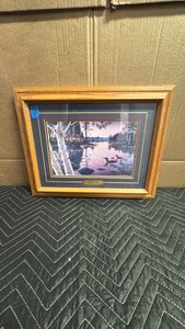Framed wildlife art print is titled Summertime by artist Mark Daehlin, featuring a tranquil lake scene with a loon family and a distant log cabin at dusk