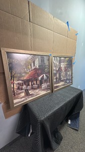 Pair of framed decorative wall art prints feature the Paris street and cafe scene titled Cafe Berlotti by artist Brent Heighton
