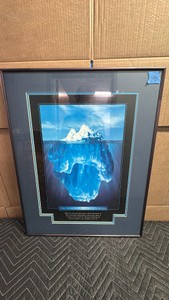 Framed item is a vintage Successories The Essence of Imagination motivational iceberg poster from 1998, featuring an underwater view of an iceberg and an inspirational quote about looking past what is visible on the surface