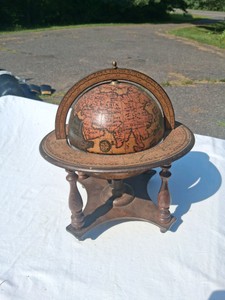 SMALL WOODEN GLOBE ON A STAND