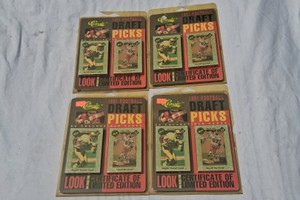 4 UNOPENED PACKAGES OF 1991 ROOKIE CARDS.  BRETT FARVE INCLUDED