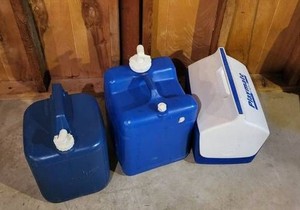 Igloo Playmate Cooler, Water Jugs, Holmes Fan Garage Camping Lot