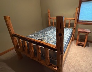 cabin style log full size bed with with beauty rest, Gemini extra firm mattress and boxspring plus a side table