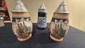 two German beer steins from Munich Olympics 1972 and durch die Auen stein