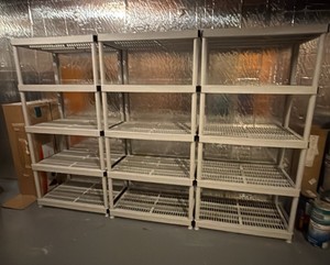 three plastic heavy duty storage shelves