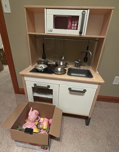 kids kitchen with microwave pots, and pans and other accessories